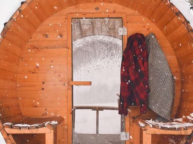 If you were aiming for cozy and you find yourself in a barrel-shaped sauna nestled in the snow, it’s safe to say you’ve overachie